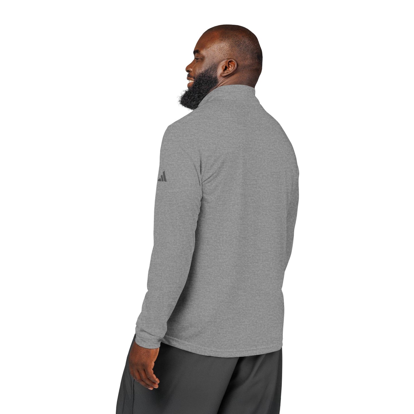 Man wearing a gray Adidas long-sleeve shirt on a white background