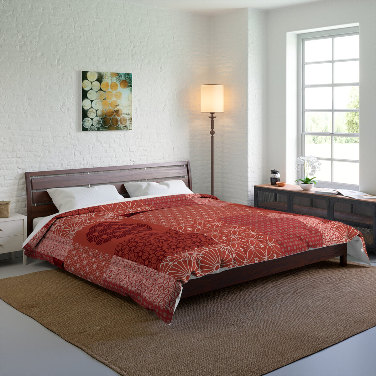 Bedroom with a bed covered in a red patterned comforter, wooden headboard, and side tables.