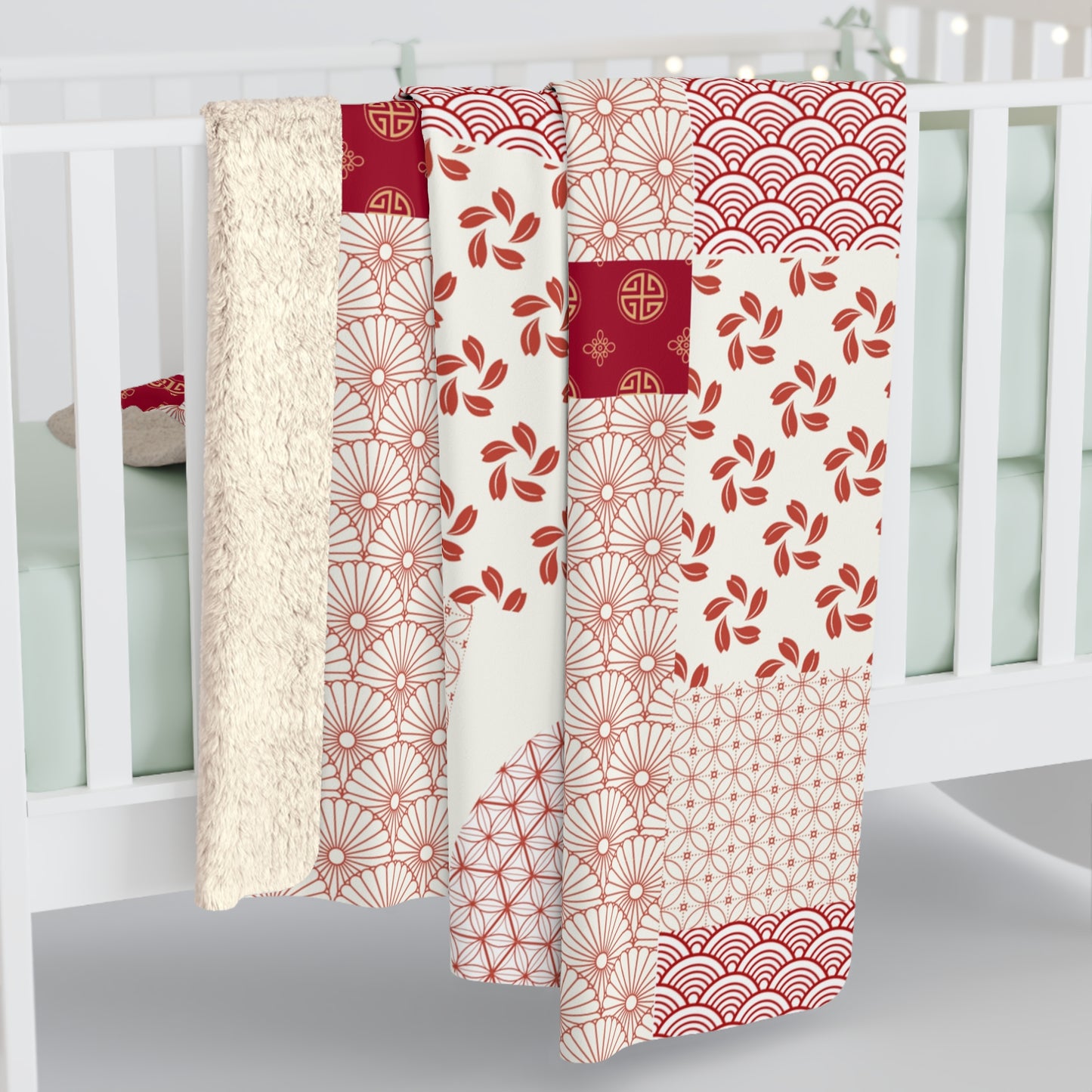 Three patterned curtains hanging in front of a white window frame.