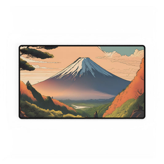 A large mousepad depicting a scenic illustration of Mount Fuji at sunrise, placed on a desk with a keyboard and monitor.