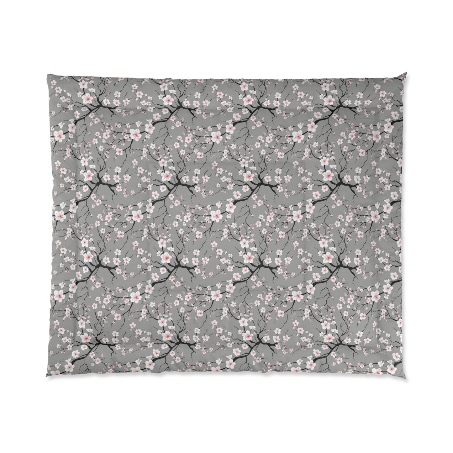 Floral patterned blanket with cherry blossoms on a gray background