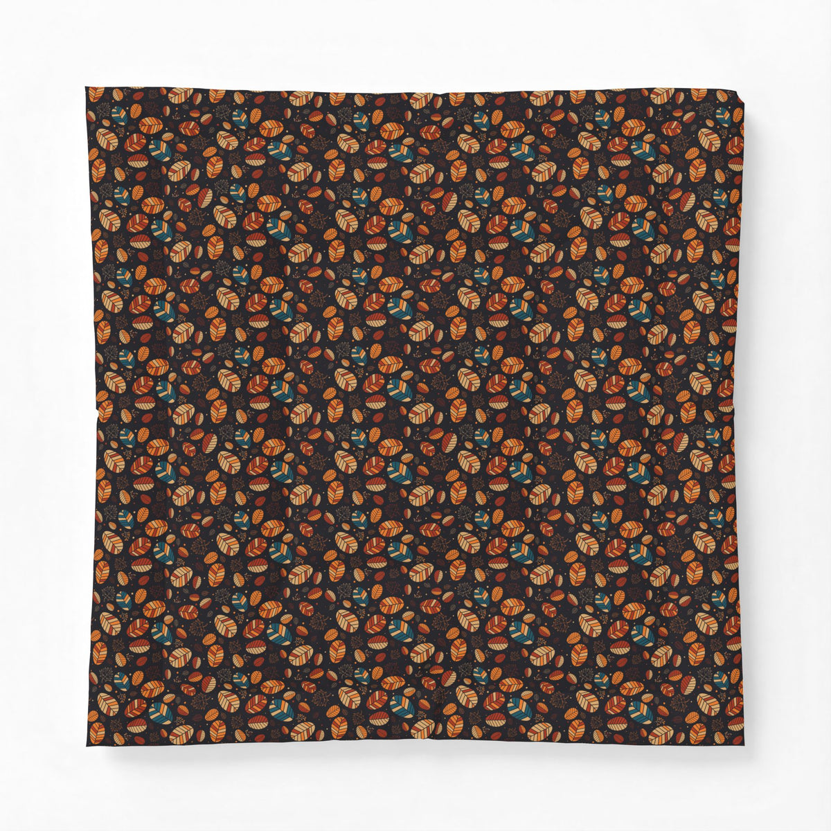 A square fabric item, likely a bandana or scarf, featuring an all-over dense pattern of small illustrated faces in orange, brown, and teal on a very dark background, displayed flat against a light gray backdrop.