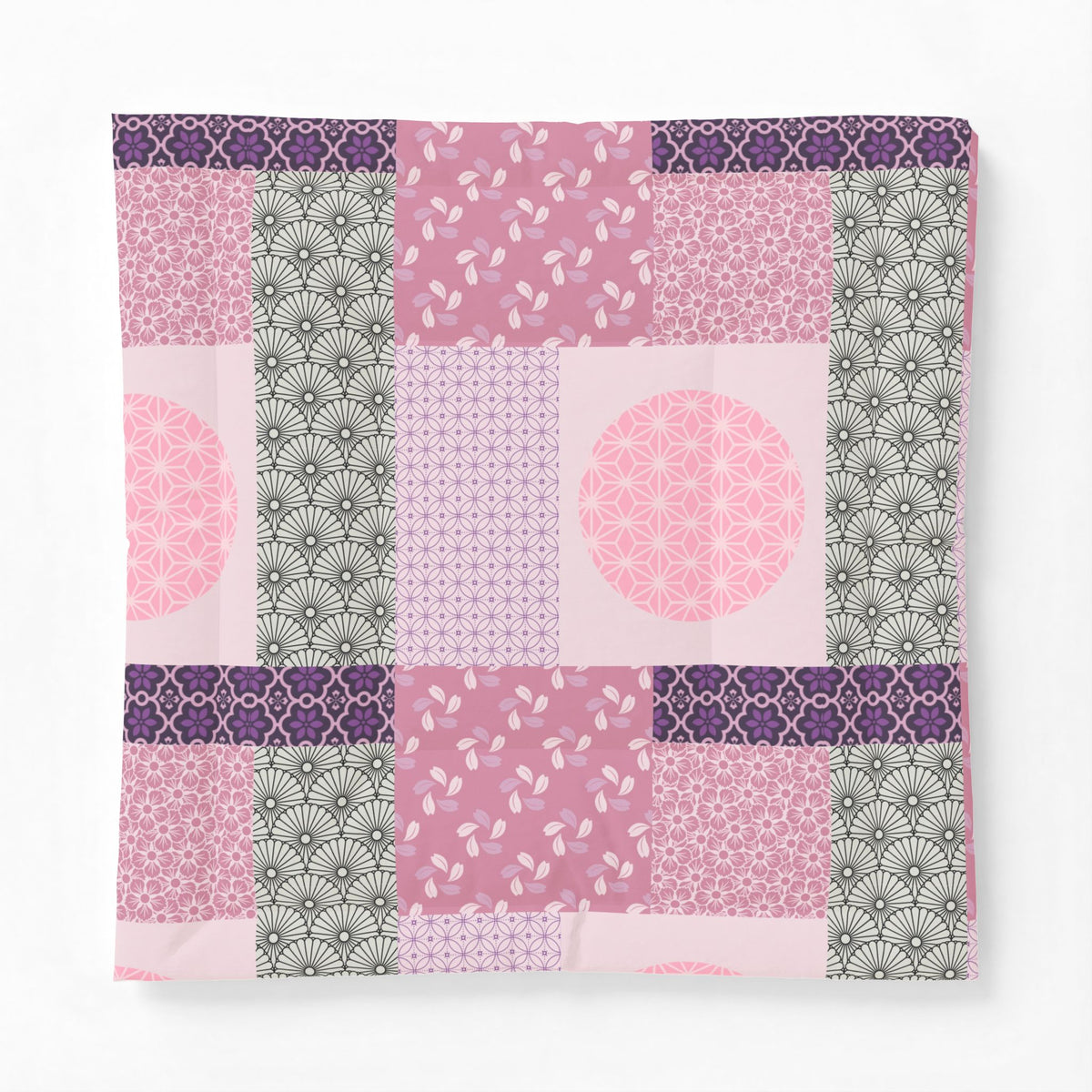 Patchwork patterned fabric with pink, purple, and gray colors on a white background