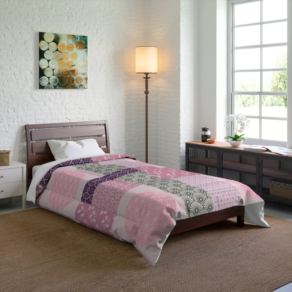Bedroom with a bed covered in a pink and green patchwork comforter, wooden headboard, and side tables.