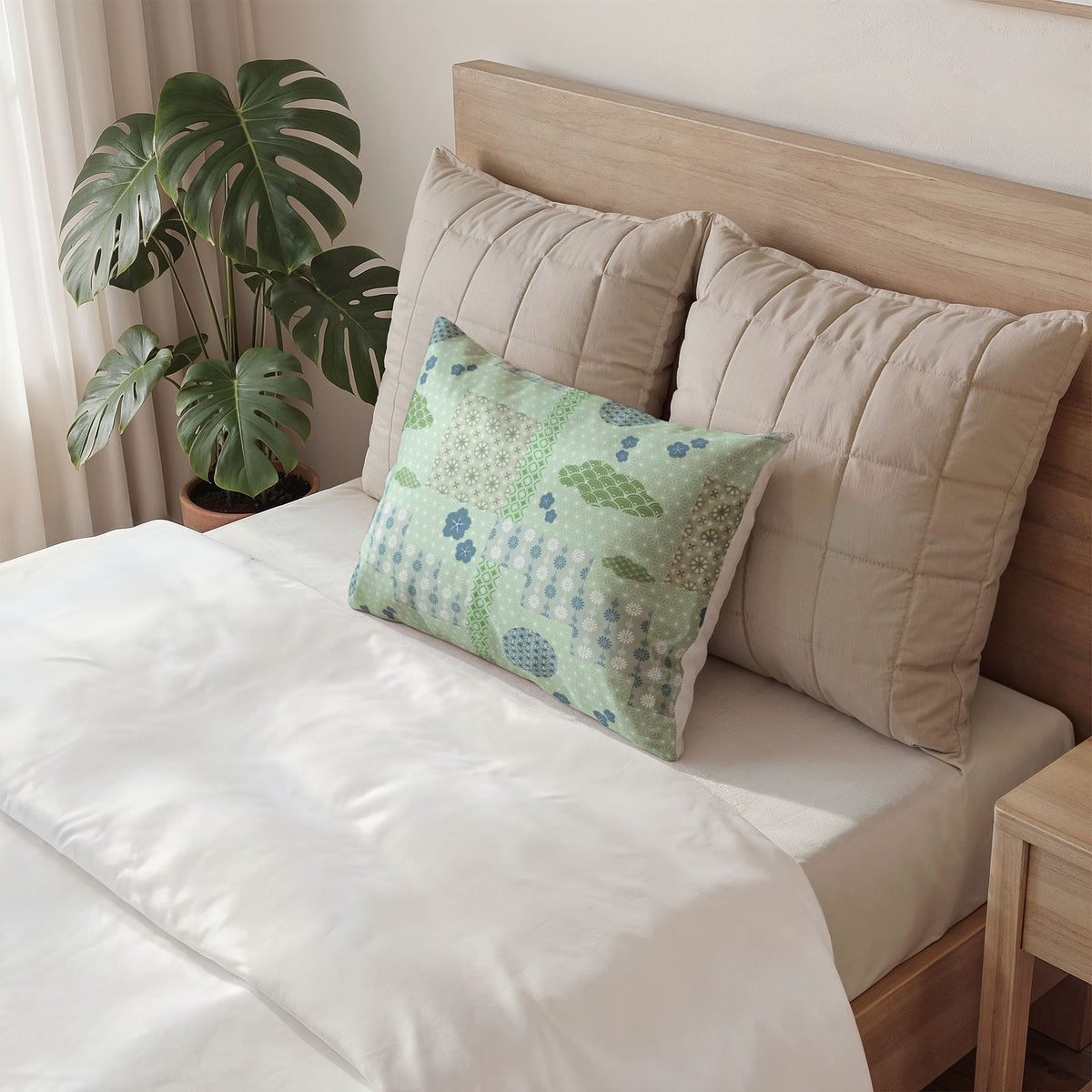 Decorative pillow with colorful eye pattern on a bed in a bedroom setting.