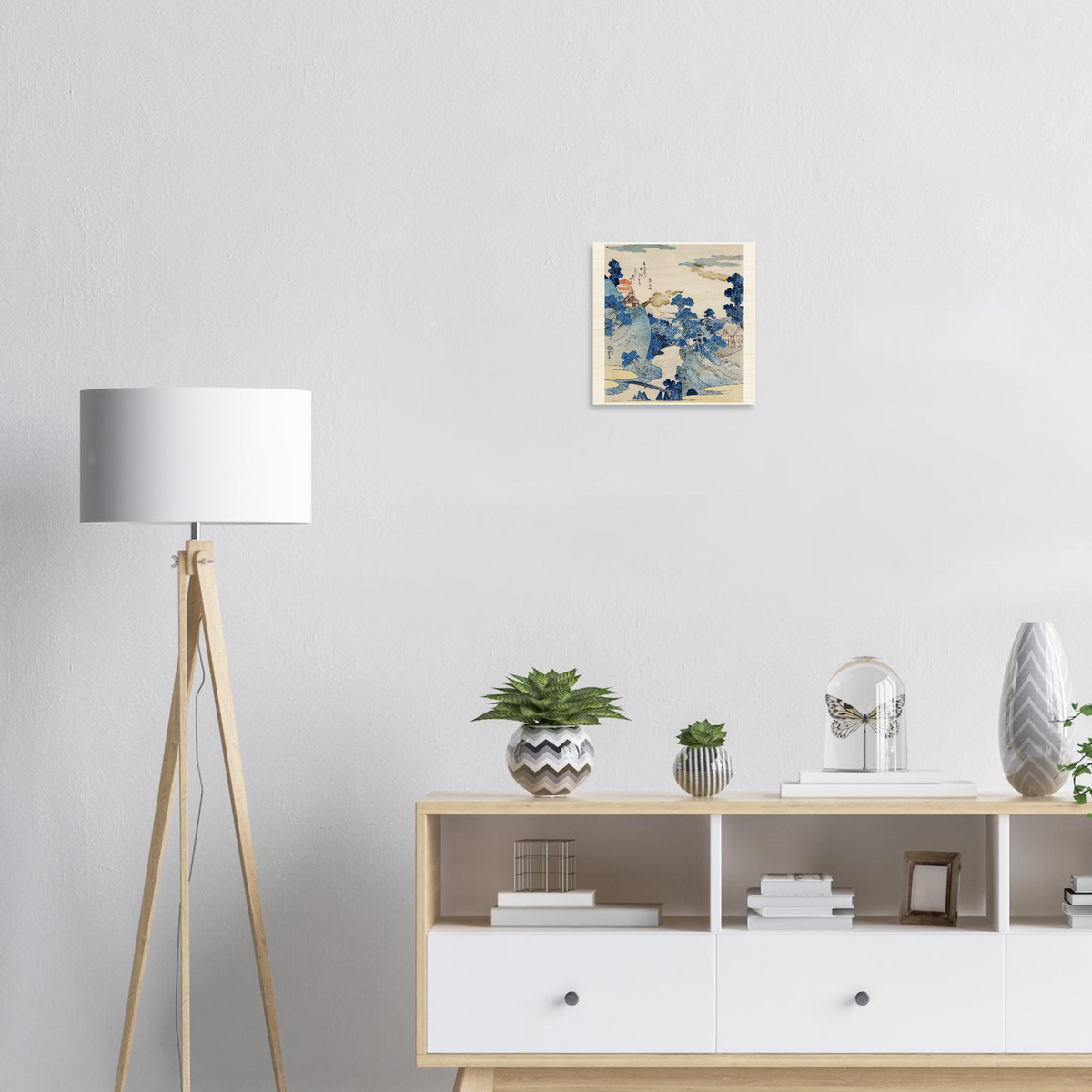 Modern interior with a floor lamp, decorative items on a shelf, and a framed artwork on the wall.