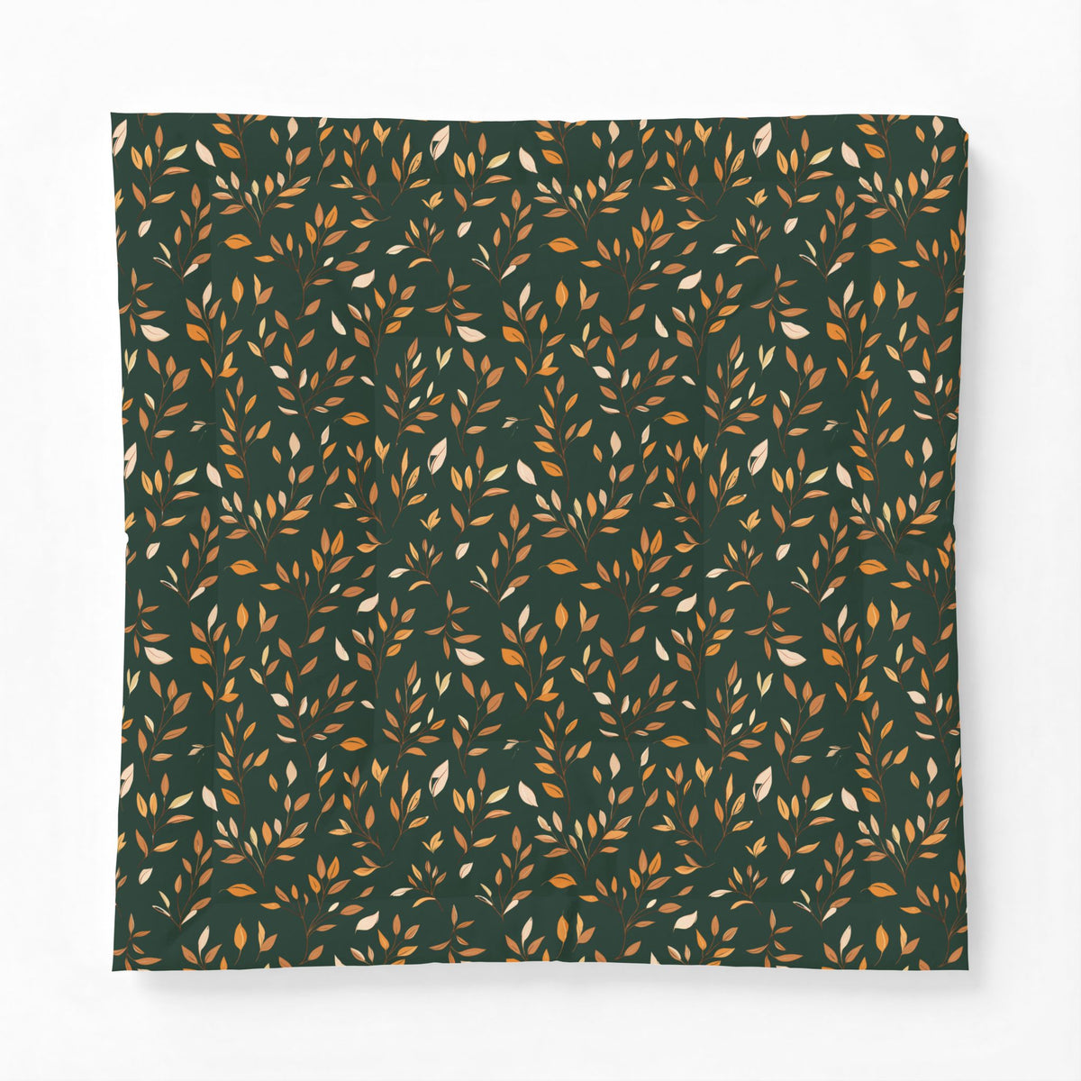 A square fabric item, likely a pillowcase or blanket, featuring an all-over repeating pattern of small leafy branches in warm orange, mustard, and cream on a dark forest green background.