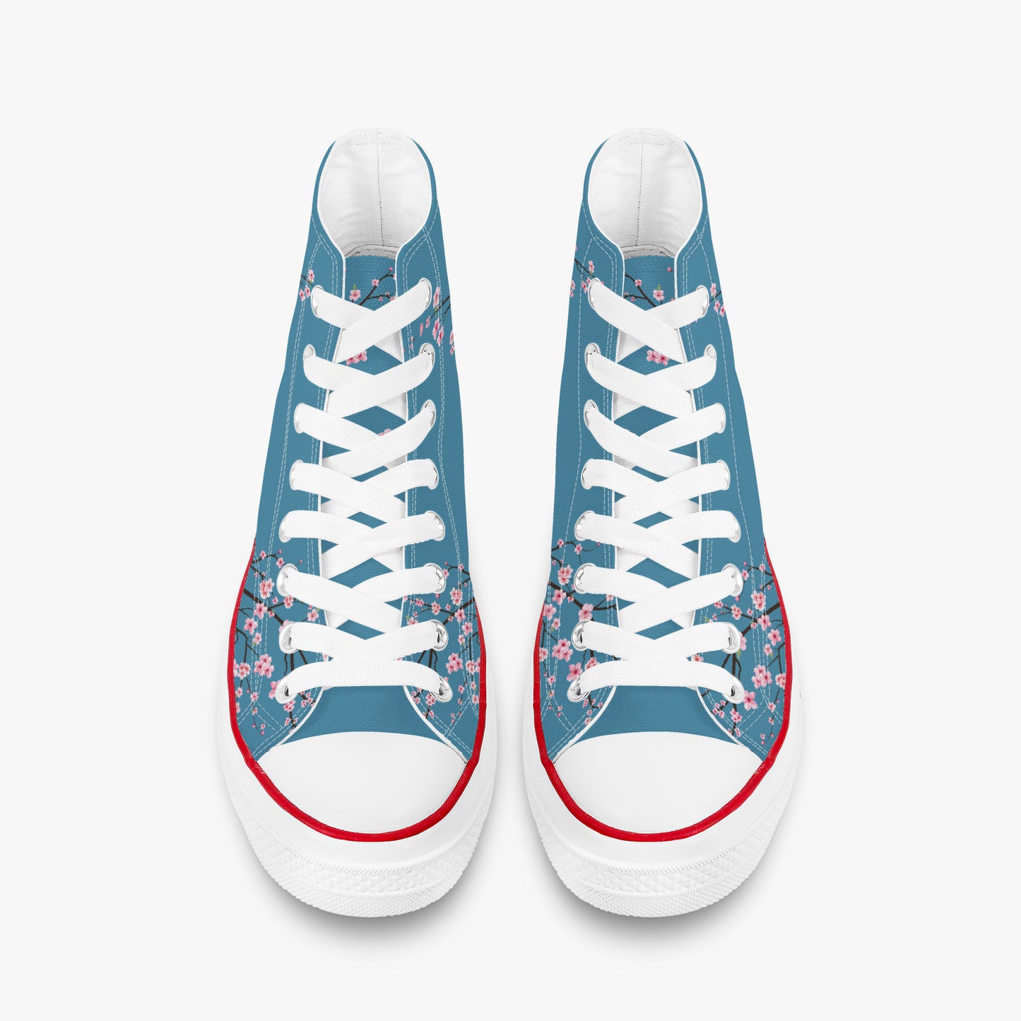 Pair of blue sneakers with floral patterns and white laces on a white background