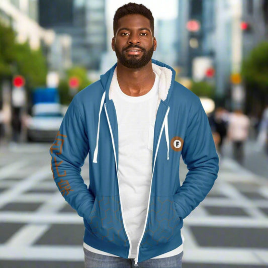 "Blue ultra-soft microfleece zip hoodie with a patterned lining, orange Japanese text on the sleeve, and an orange 'F' logo, inspired by the Tokyo Metro Fukutoshin Line."