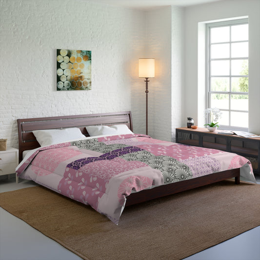Bedroom with a bed covered in a pink and purple patchwork comforter, wooden headboard, and side tables.