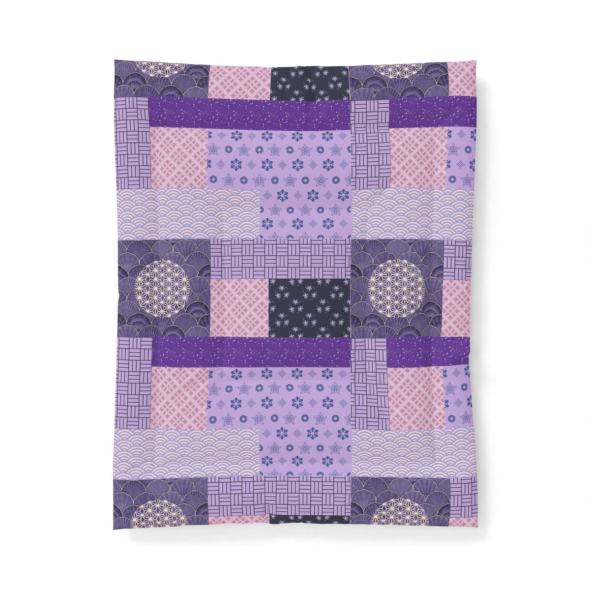 Patchwork quilt with purple and pink squares on a white background. Heritage Cotton