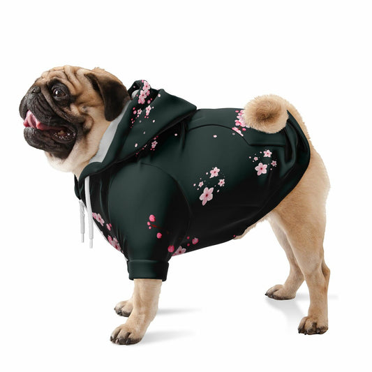 A dog wearing a premium dark grey athletic zip-up hoodie featuring a delicate pink Sakura cherry blossom print, inspired by Japanese spring gardens.