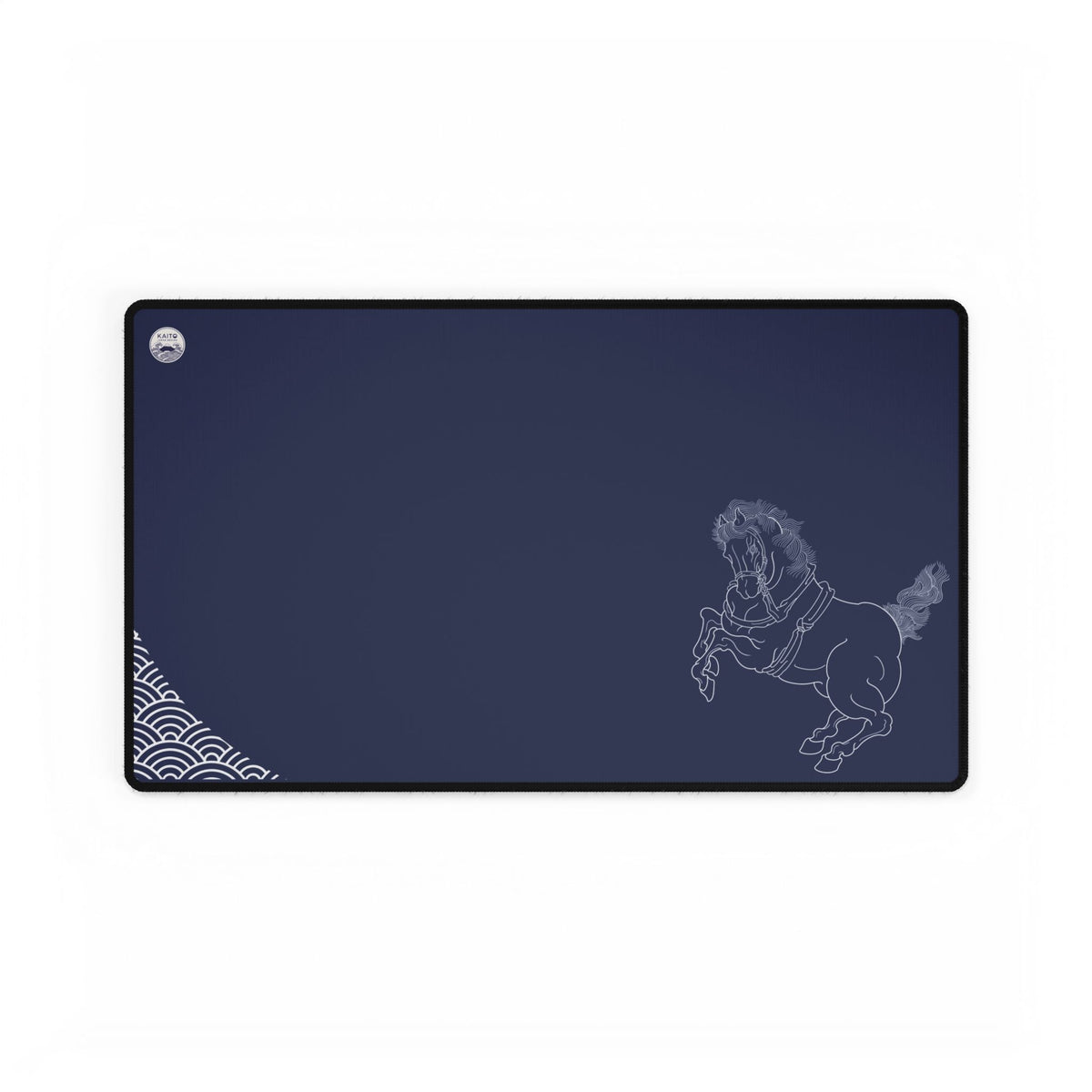 A deep indigo desk mat featuring white line art of a rearing Shinme horse and Seigaiha wave patterns, organized for a clean workspace aesthetic.