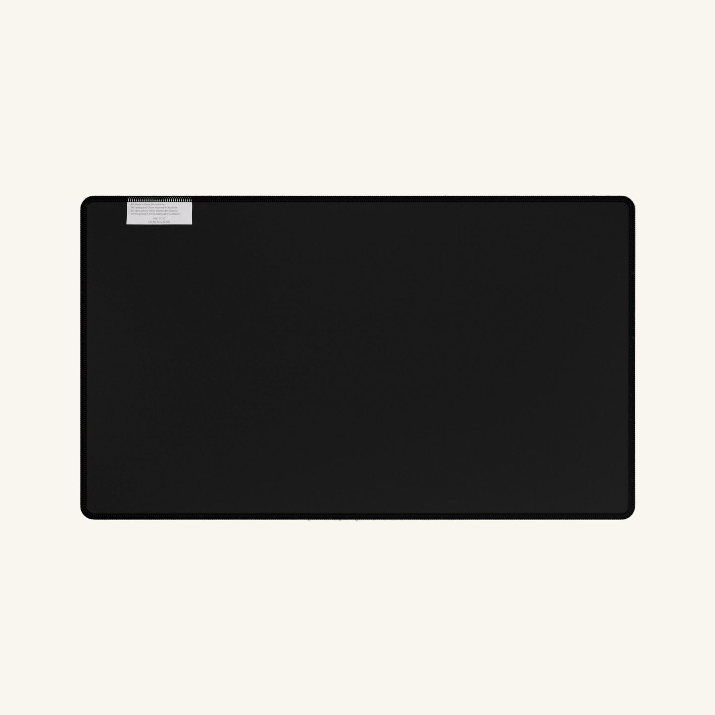 Black rectangular object with a silver accent on a white background