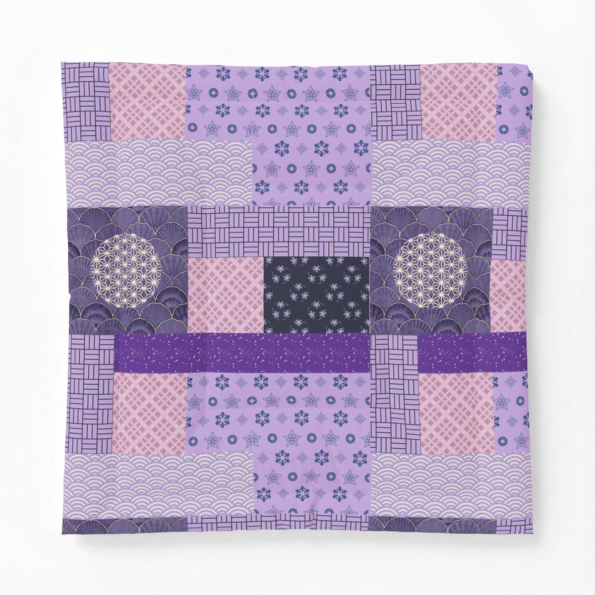 Patchwork quilt with various purple patterns on a white background. Heritage Cotton