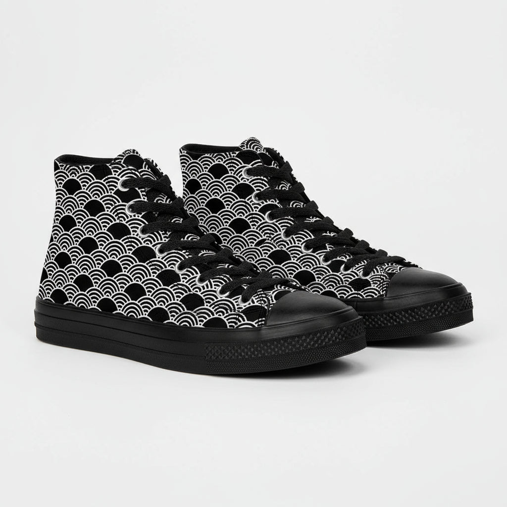 Black high-top sneakers with white wave pattern on a cardboard box