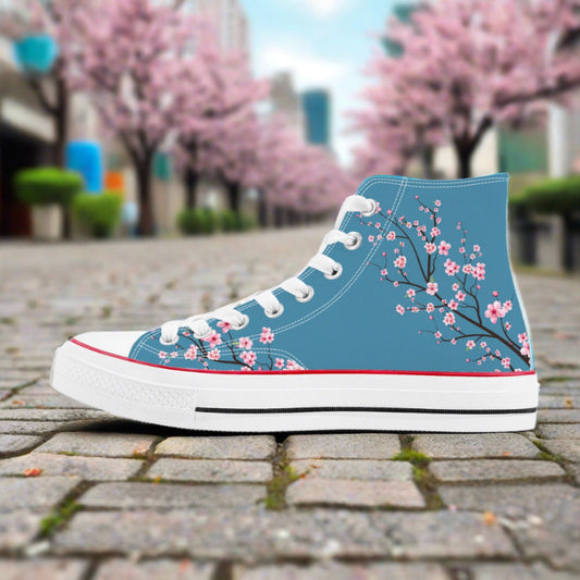 Premium high-top canvas sneakers featuring a vivid blue sky background with an all-over pink cherry blossom (Sakura) print.