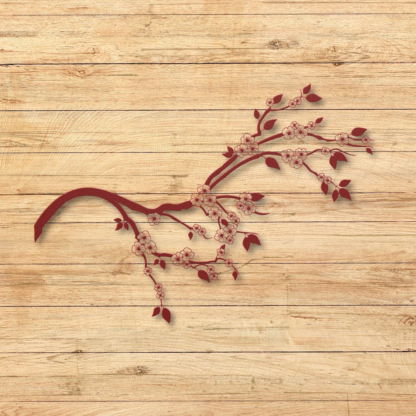 Decorative red branch with flowers on a wooden background