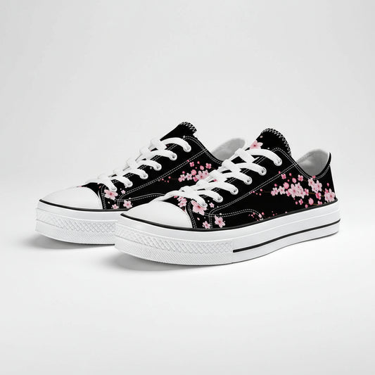 Modern black and white low-top canvas sneakers featuring high-contrast pink cherry blossom (Sakura) accents.