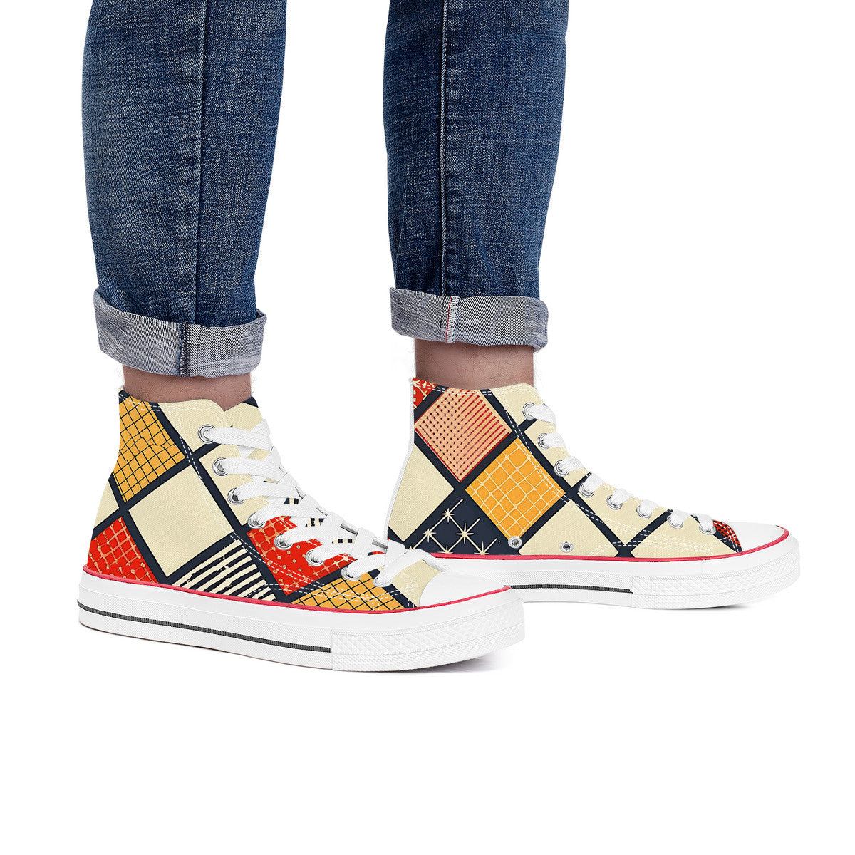 High-top sneakers with a colorful geometric pattern worn with rolled-up jeans on a white background