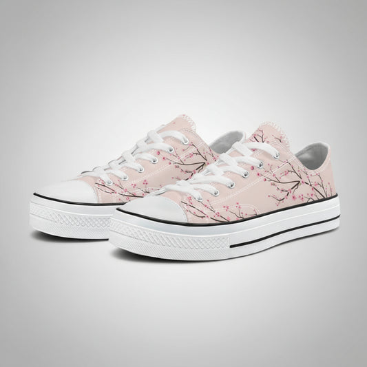 Classic low-top canvas sneakers featuring a vibrant rose-pink background with a detailed all-over white and light pink Japanese cherry blossom (Sakura) pattern.