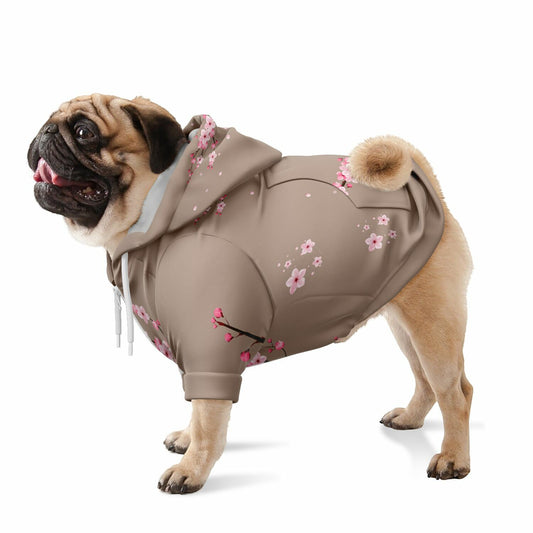A dog wearing a premium light brown athletic zip-up hoodie featuring a delicate pink Sakura cherry blossom pattern, inspired by Japanese nature and spring aesthetics.