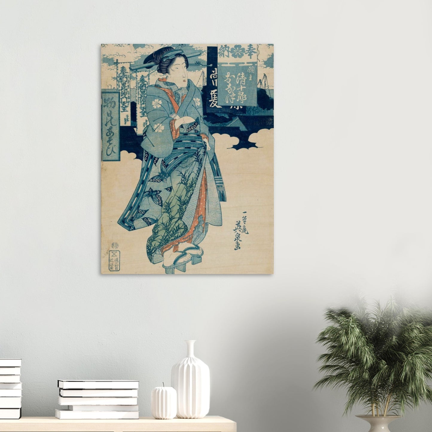 Traditional Japanese artwork on a wall with decorative items below