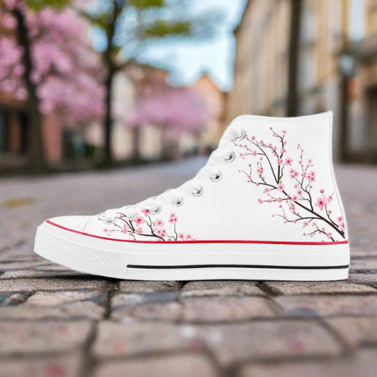 Premium white high-top canvas sneakers featuring an all-over delicate pink and white Japanese cherry blossom (Sakura) print with a classic 8-eyelet design.