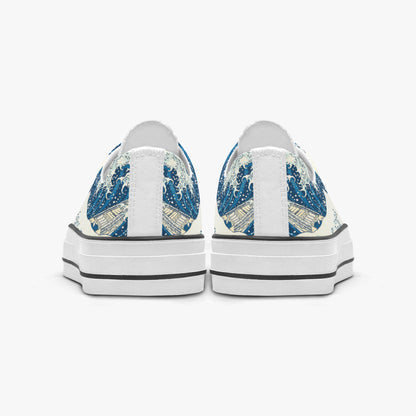 White sneakers with blue floral patterns on a white background