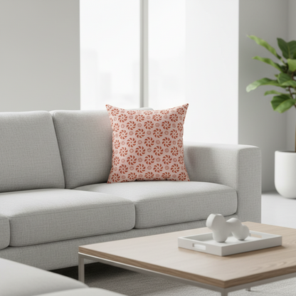 Gray sofa with a floral-patterned pillow in a modern living room setting.
