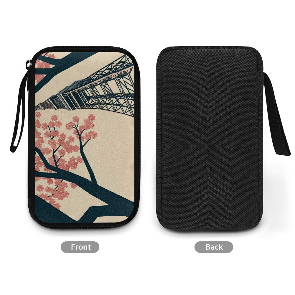 Two views of a pouch with Tokyo Tower and cherry blossom design on one side, black on the other.
