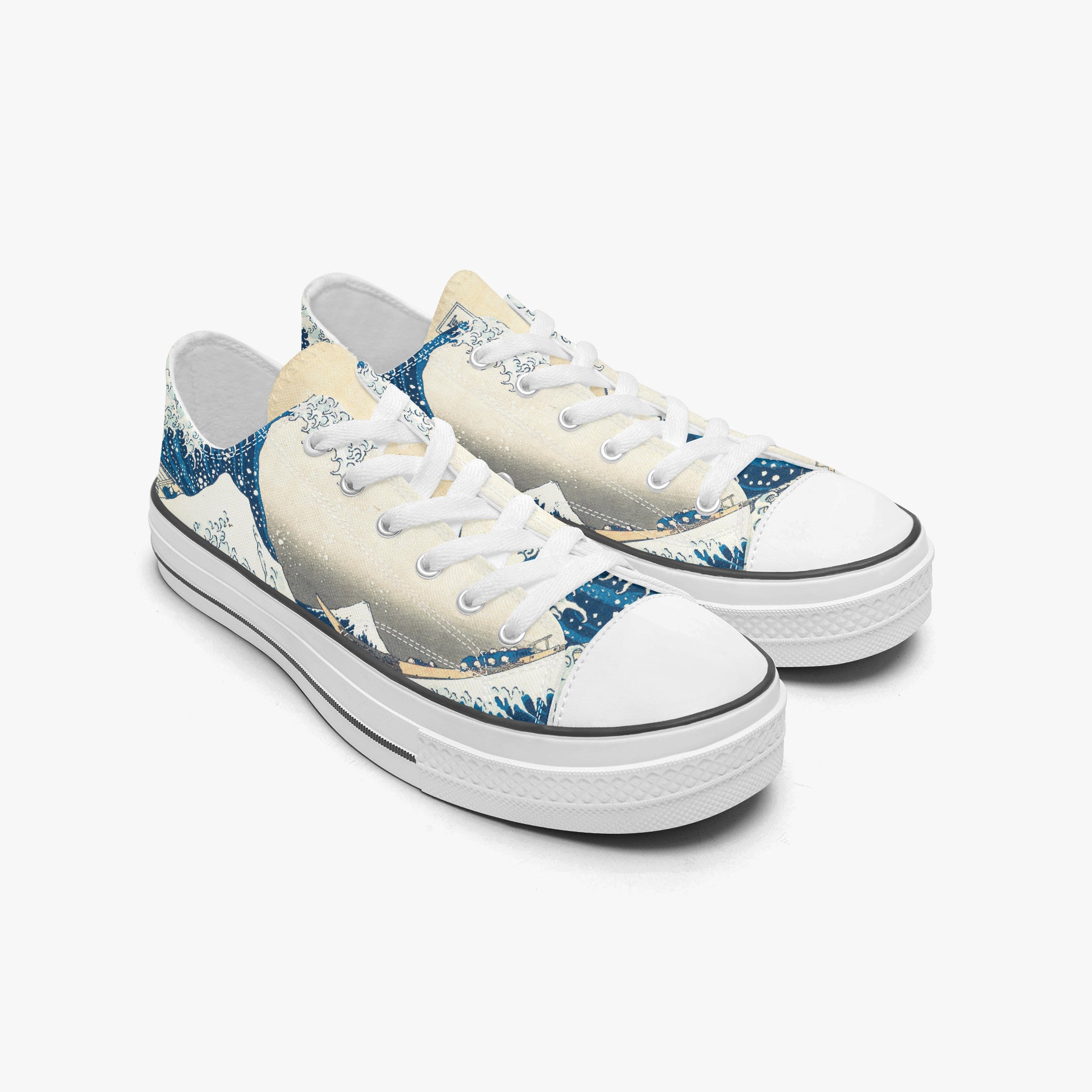 Pair of sneakers with a mountain and wave design on a white background
