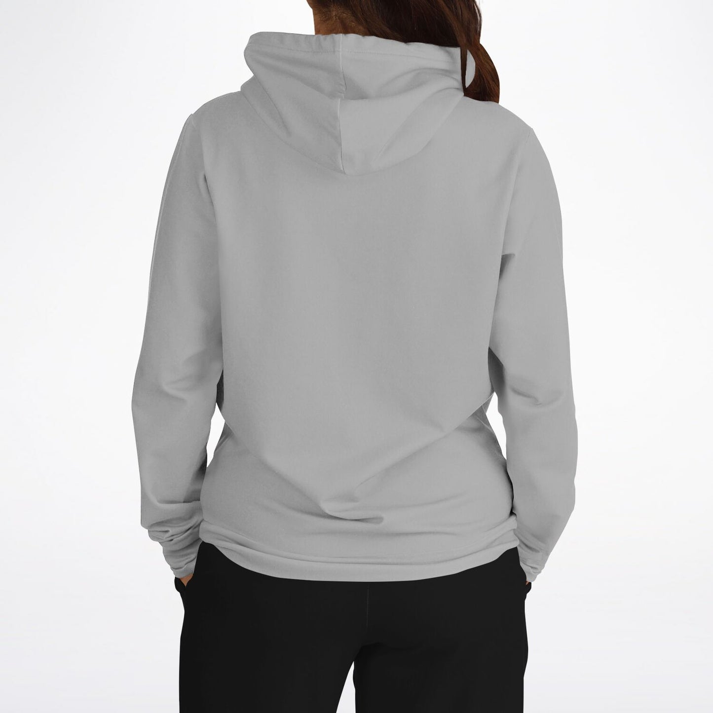 A person shown from the back wearing a light gray hooded sweatshirt and black pants against a plain white studio background.
