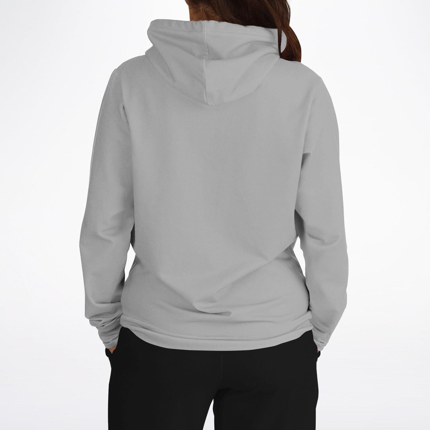 A person shown from the back wearing a light gray hooded sweatshirt and black pants against a plain white studio background.