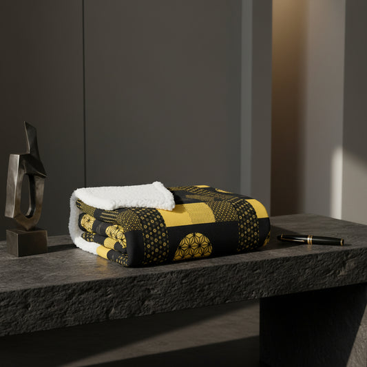 Black and yellow patterned fabric with geometric designs on a white background