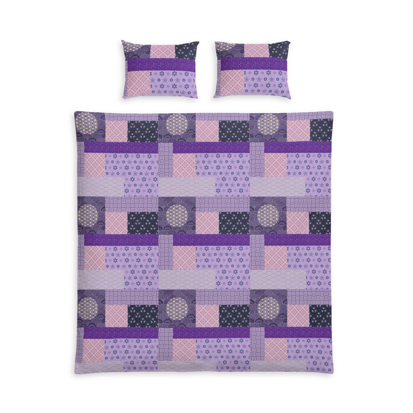 A bedding set featuring a patchwork quilt and two matching pillowcases in shades of purple, pink, and dark gray, displayed on a solid white background.