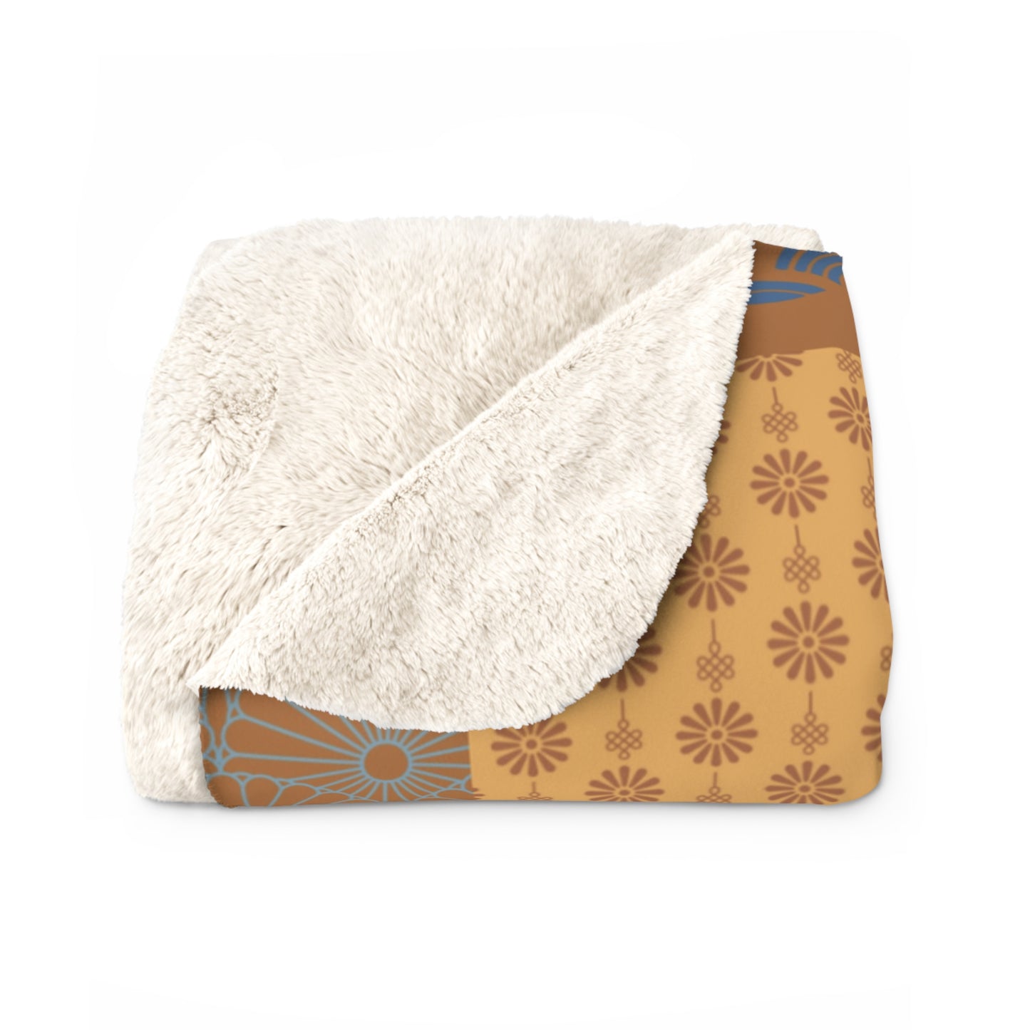 Blanket with white fleece interior and brown floral pattern exterior on a white background