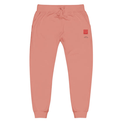 Coral sweatpants with a graphic design on a white background