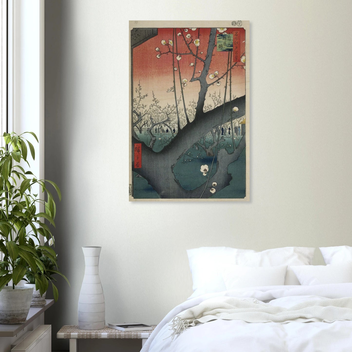 Framed artwork on a wall above a bed in a bedroom