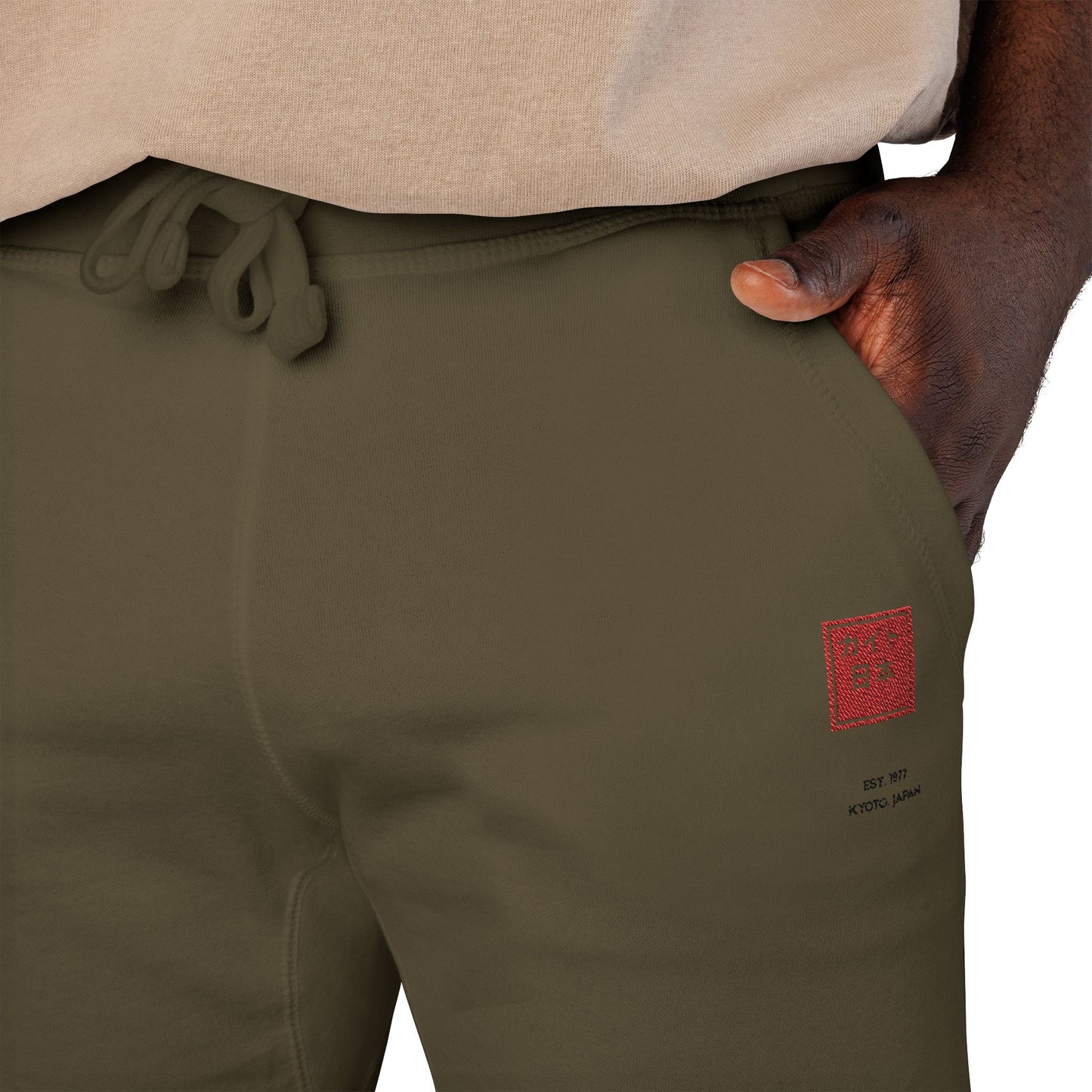 Green pants with a red logo on a white background