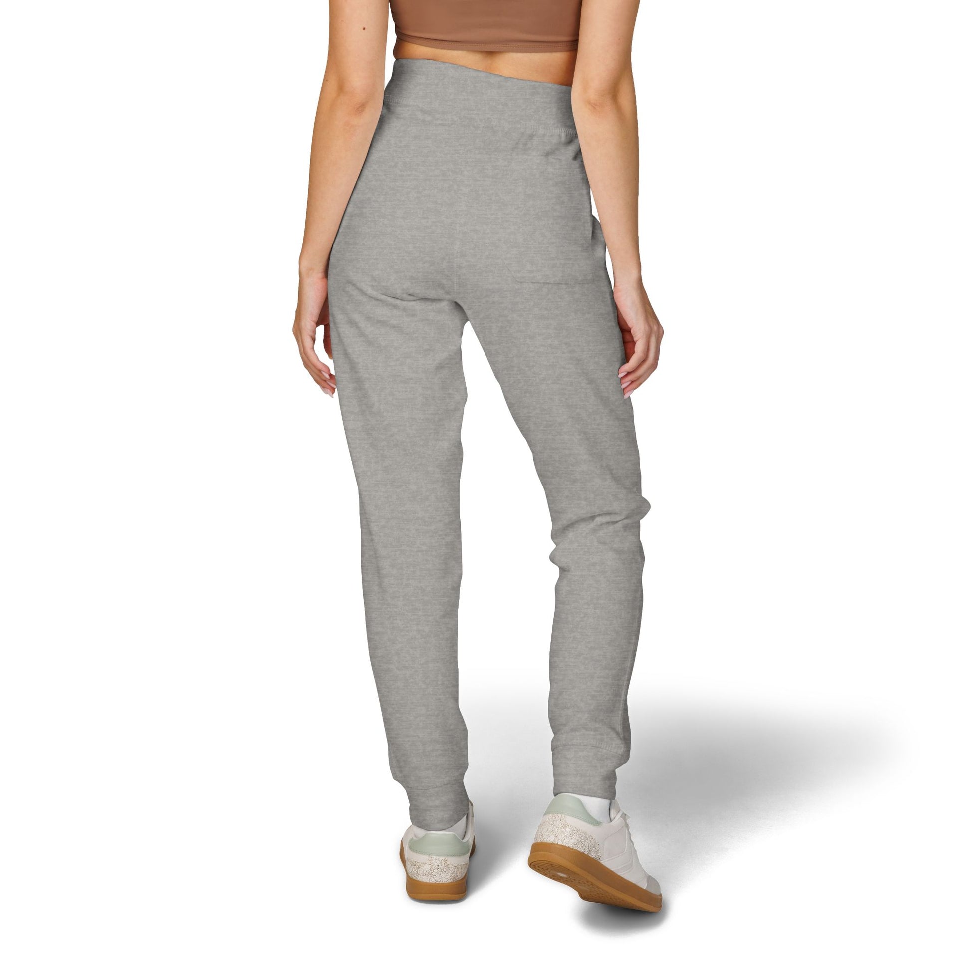Person wearing gray sweatpants on a white background