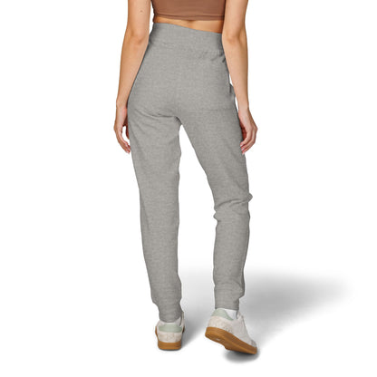 Person wearing gray sweatpants on a white background