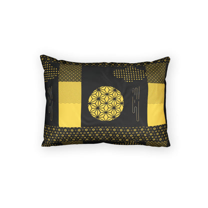 A rectangular decorative throw pillow with a black and yellow geometric patchwork design, featuring a central flower-of-life motif, shown against a plain white background.