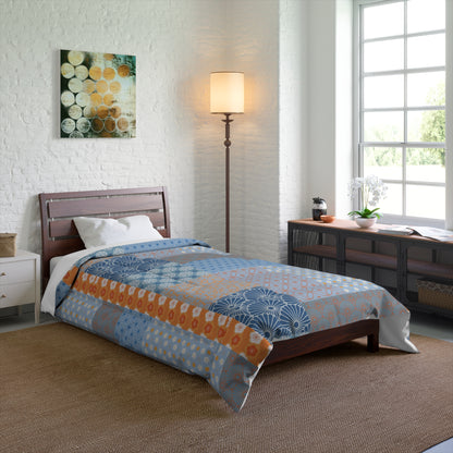 Bedroom with a bed covered in a patterned comforter, wooden headboard, and side tables.