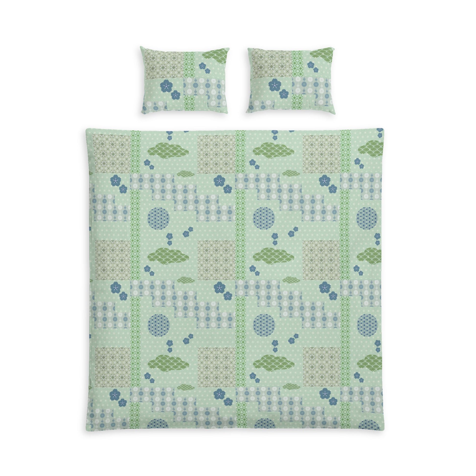 A bedding set featuring a duvet cover and two matching pillowcases with a patchwork-style geometric pattern in sage green, light blue, and beige on a white background.
