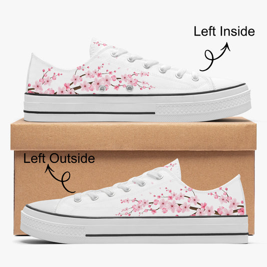 White sneakers with cherry blossom design on a brown box
