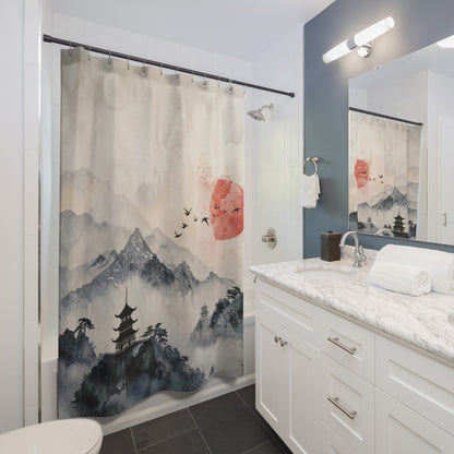 A bathroom scene showing a shower curtain with a Japanese-inspired landscape print featuring misty mountains, a pagoda, birds, and a red sun. The curtain is hanging in a modern bathroom with white cabinetry, a marble countertop, a mirror, and a blue-gray accent wall.