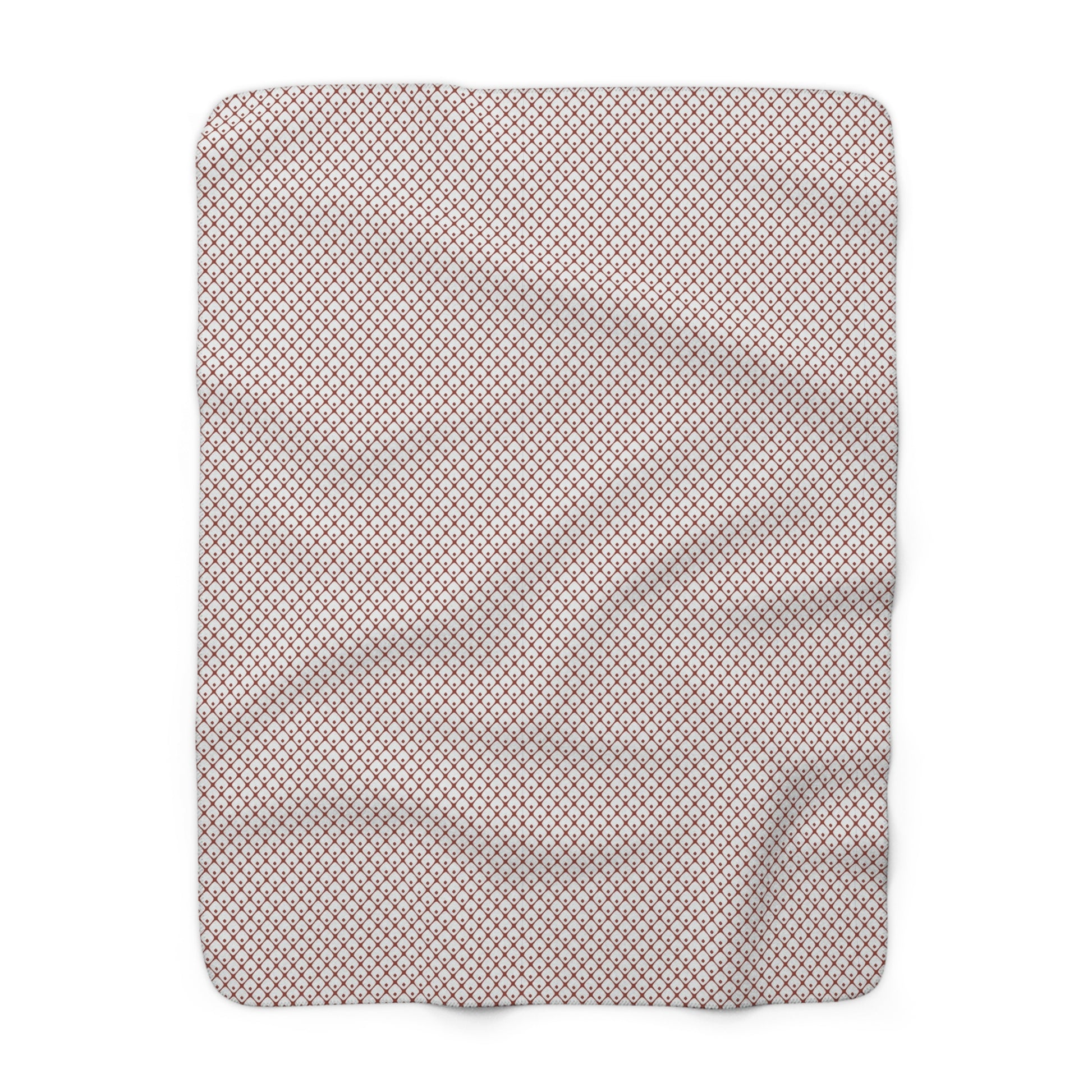 Gray blanket with white snowflake pattern on a white background