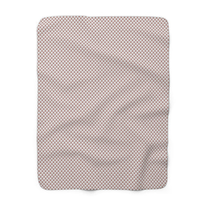 Gray blanket with white snowflake pattern on a white background