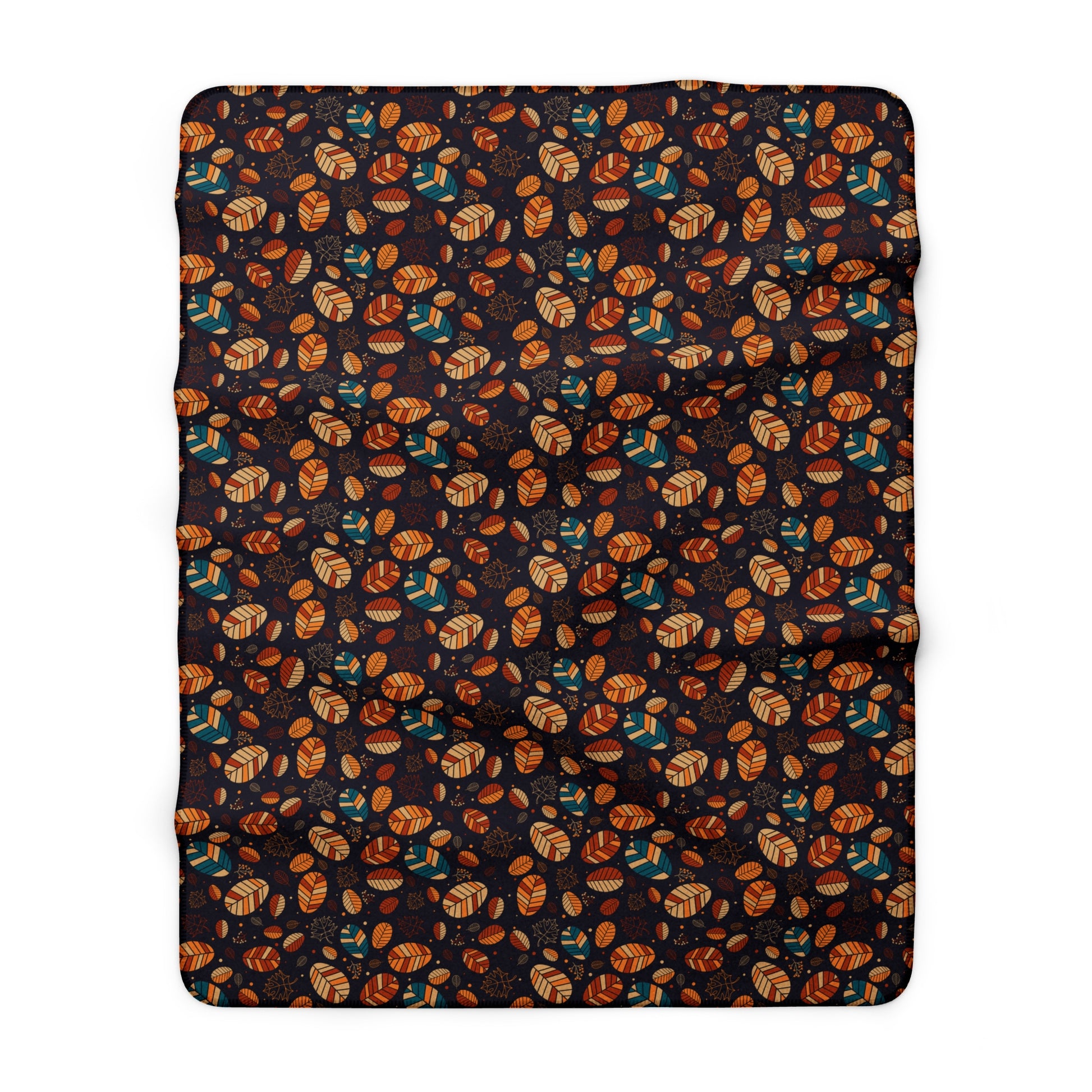 A rectangular throw blanket with a dense, all-over autumn pattern of orange and brown leaves, tan acorns, and teal birds on a very dark charcoal background, shown flat against a white background.
